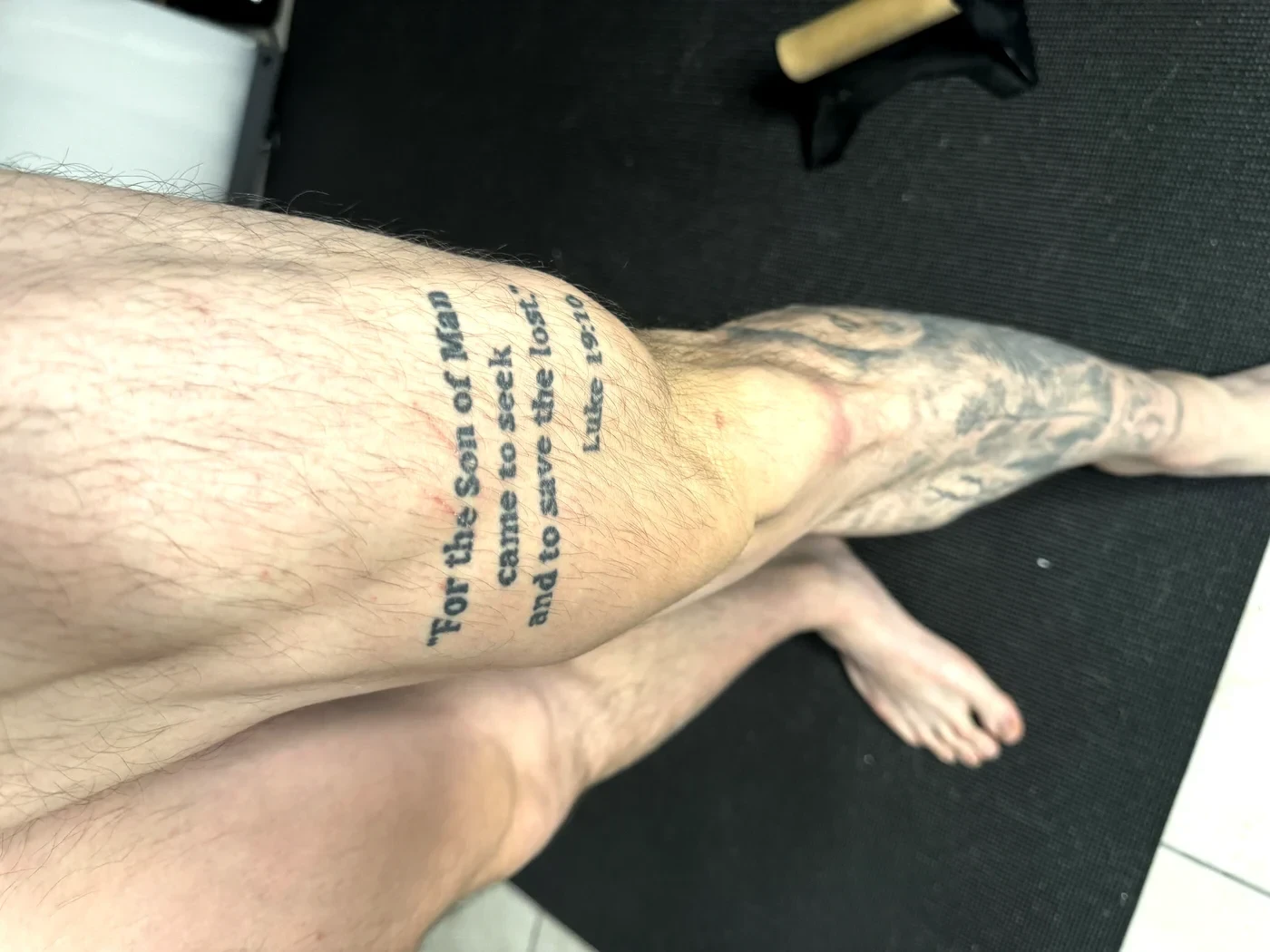 Luke 19:10 tattooed on Brandon's quad